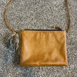 K Slade Madison Crossbody in color Saddle. 12”L x 9”H.
